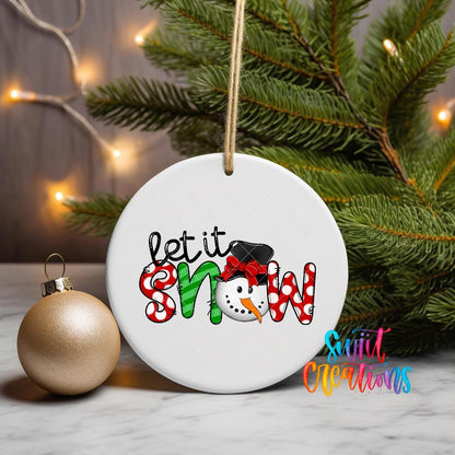 Let It Snow Patterned ornament UV DTF transfer on a hanging ornament with pine branches and a gold bauble