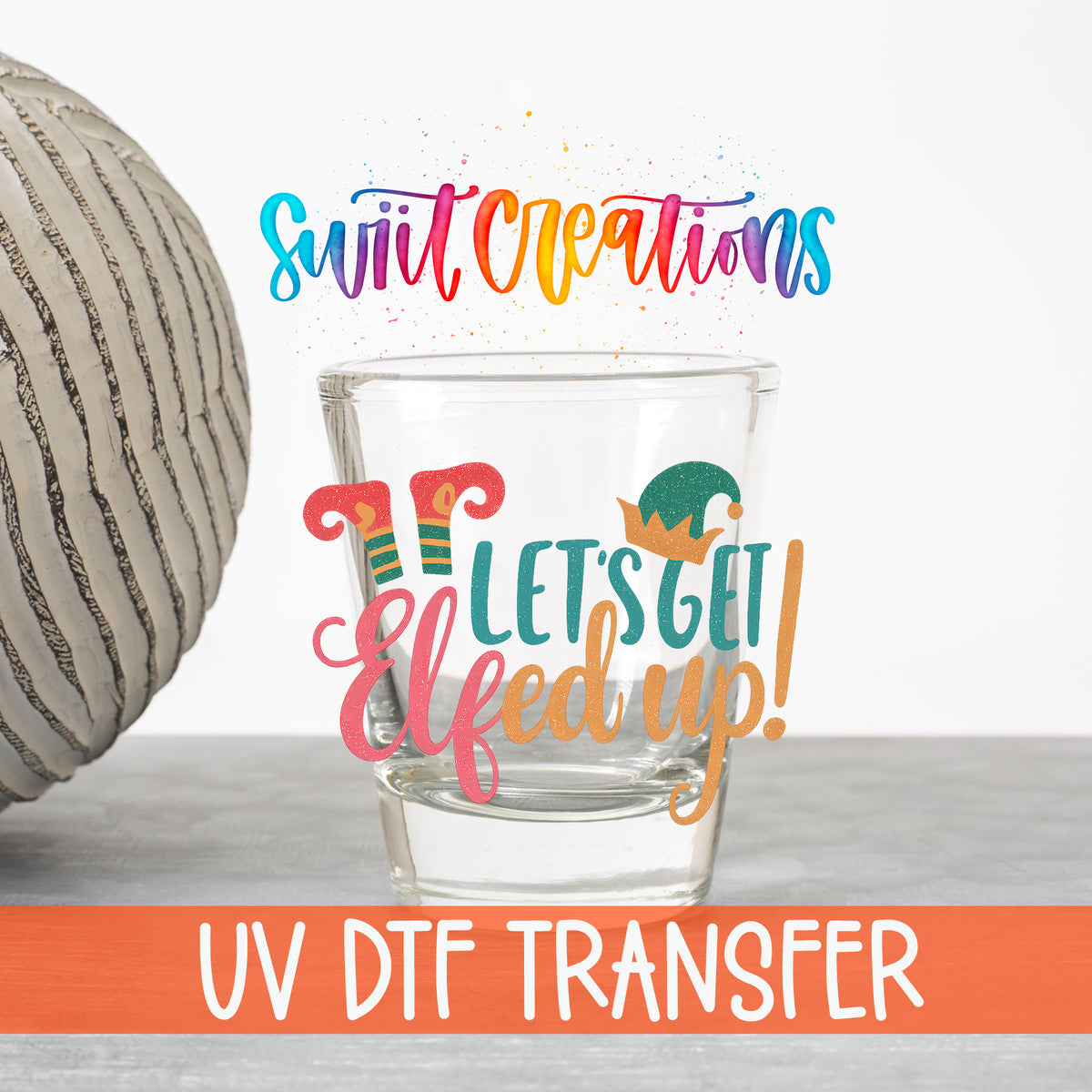 Let's Get Elfed Up UV DTF transfer on a clear shot glass with the Swiit Creations logo and UV DTF Transfer banner