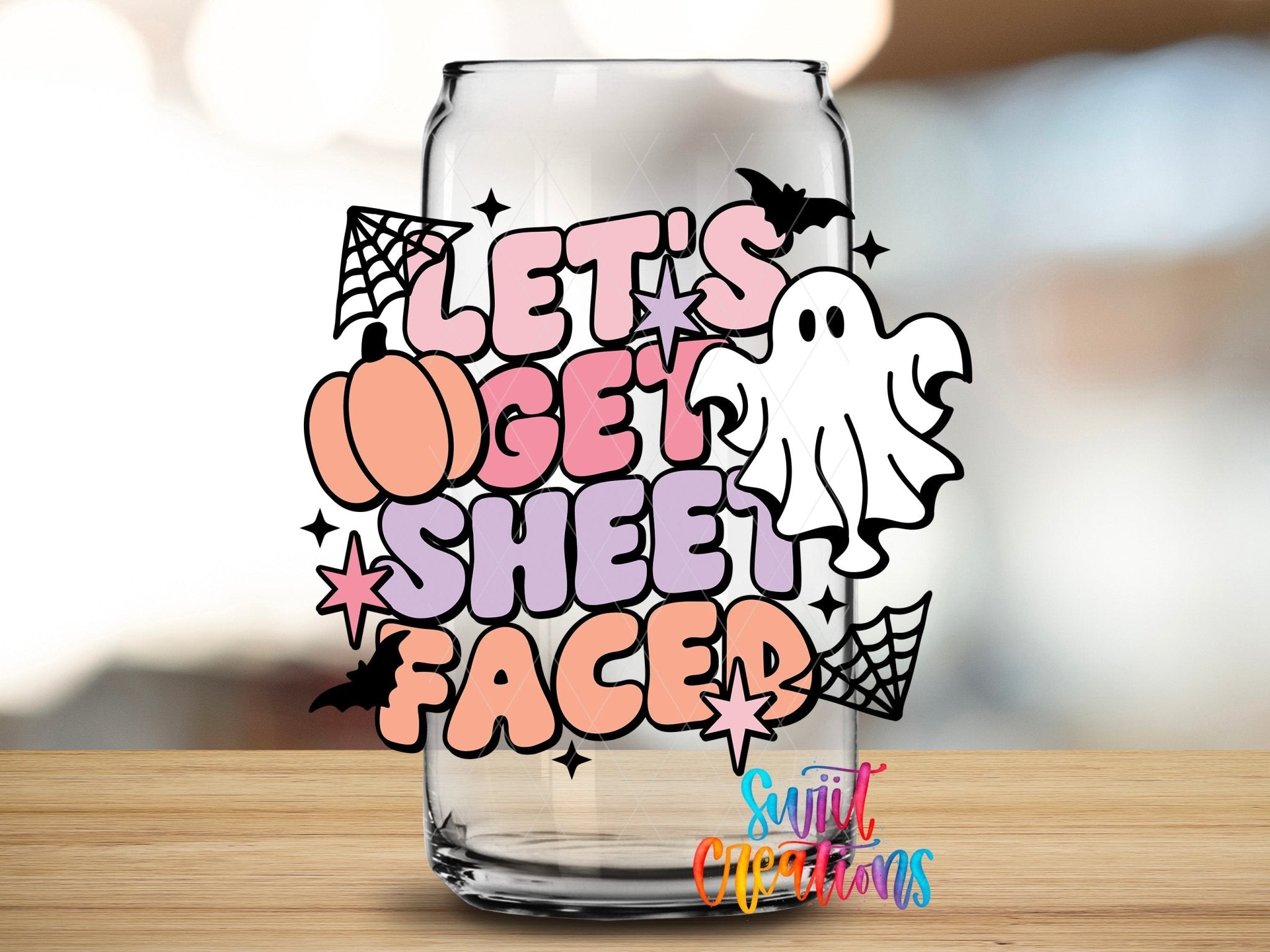 Swiit Creations UV DTF Let’s Get Sheet Faced Ghost Halloween transfer applied to a clear glass can