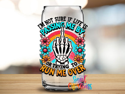 Close-up of the Life Is Passing Me By UV DTF transfer on a clear glass can
