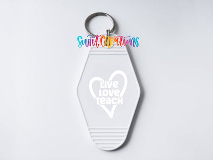Close-up of the Live Love Teach UV DTF transfer on a white motel keychain
