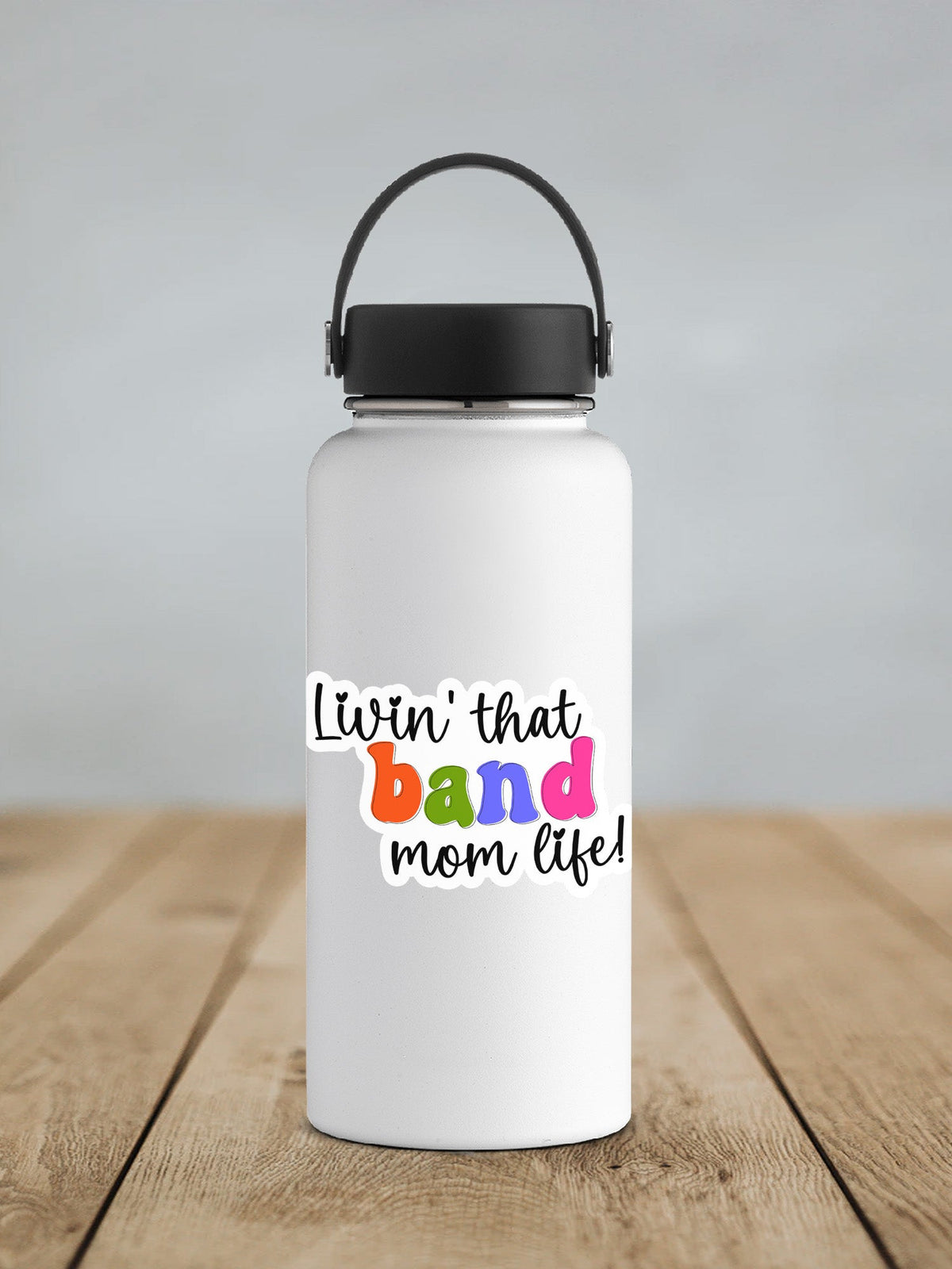 Rainbow Band Mom Life sticker on a white insulated water bottle