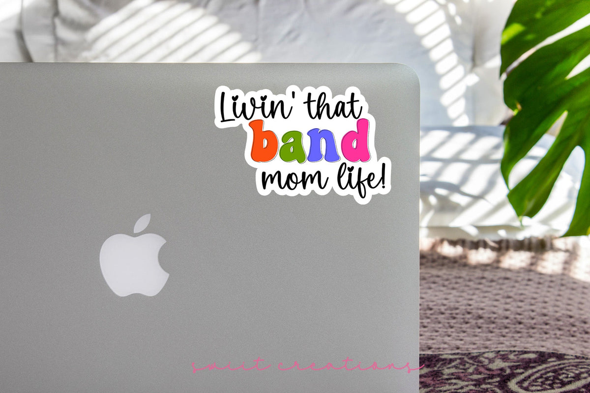Rainbow Band Mom Life sticker on the lid of a silver laptop