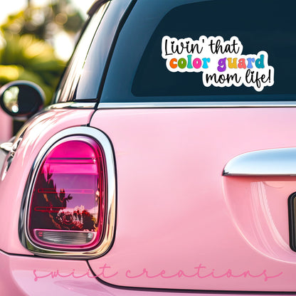 Rainbow Color Guard Mom Life sticker on the back window of a pink car