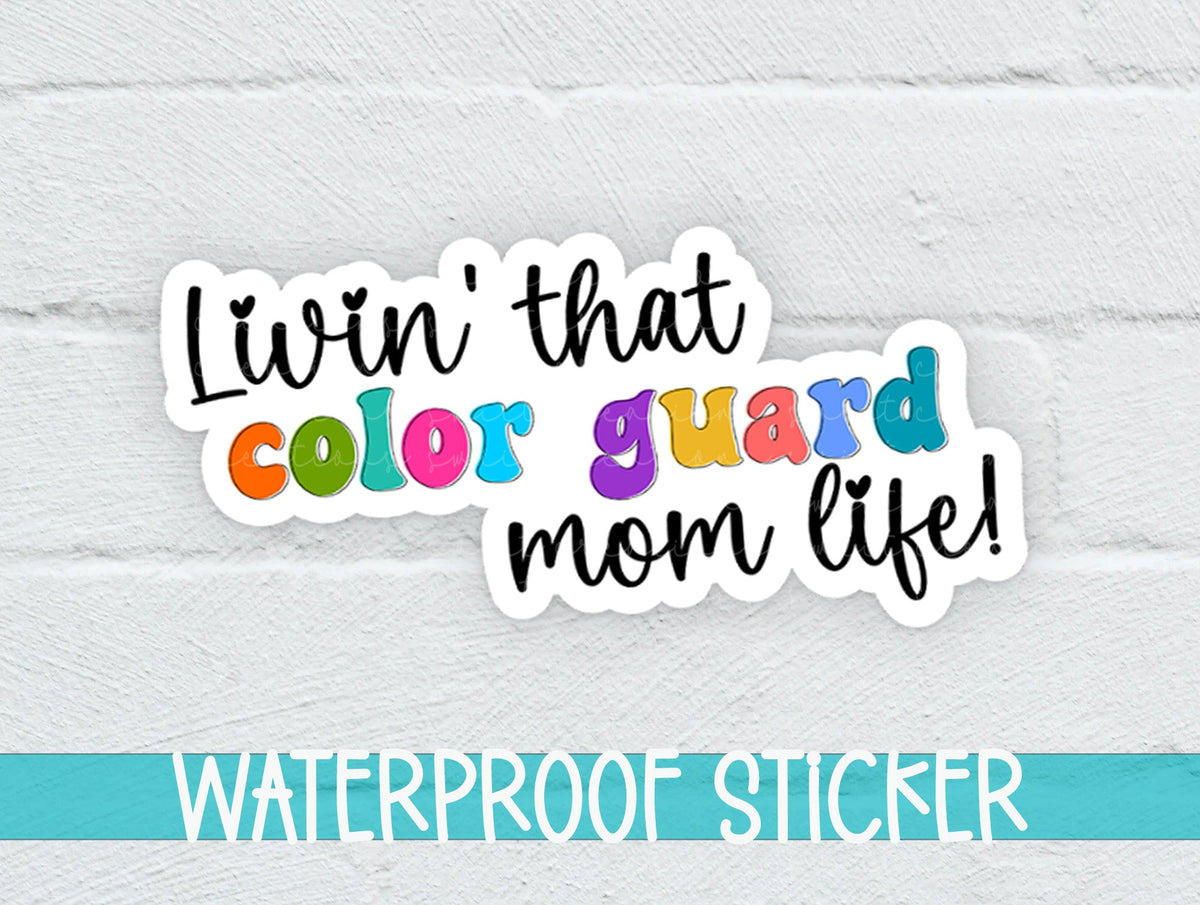Rainbow Color Guard Mom Life sticker on a white brick background with a waterproof sticker banner