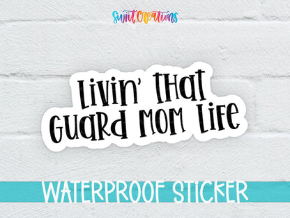 Livin' That Guard Mom Life sticker on a white brick background with a waterproof sticker banner