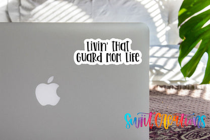 Livin' That Guard Mom Life sticker on the lid of a silver laptop