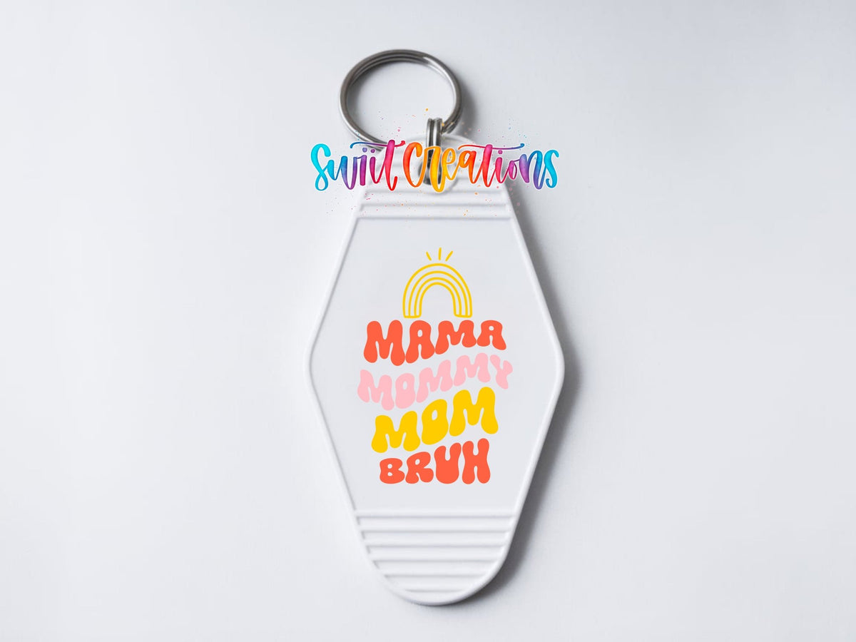 Close-up of the Mama Mommy Mom Bruh UV DTF transfer on a white motel keychain