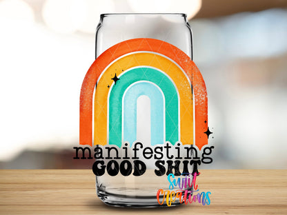 Close-up of the Manifesting Good Sh*t UV DTF transfer on a clear glass can
