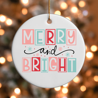 Merry and Bright ornament UV DTF transfer on a round white ornament with a bokeh light background