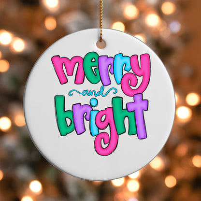 Merry and Bright ornament UV DTF transfer on a round white ornament with a bokeh light background