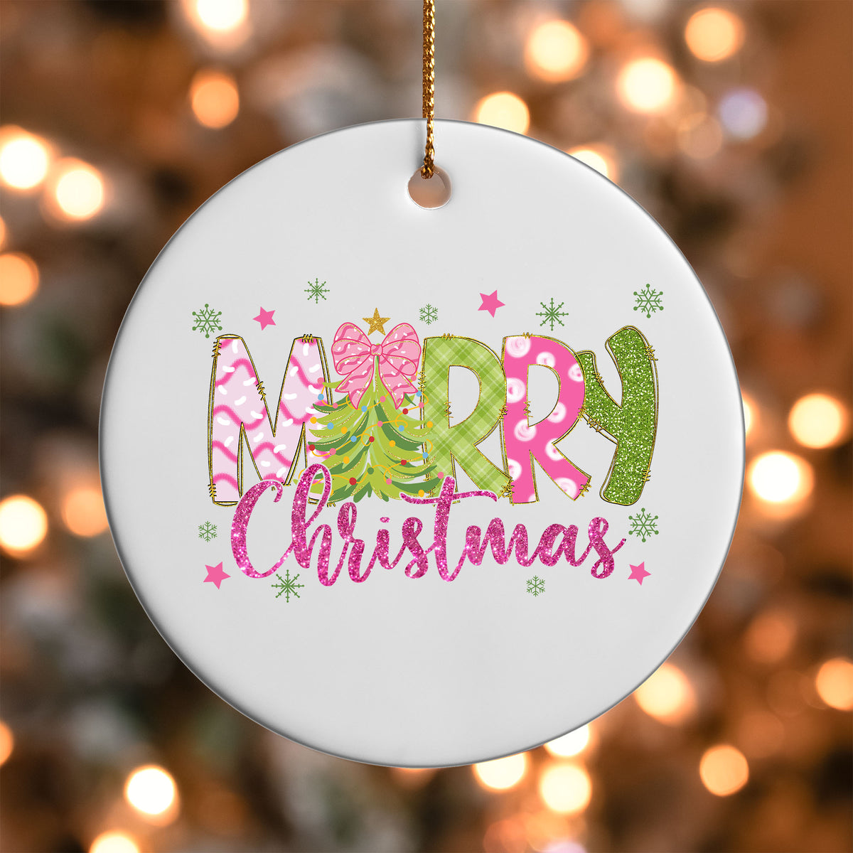 Merry Christmas Pink and Green ornament UV DTF transfer on a round white ornament with a bokeh light background