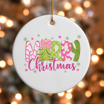 Merry Christmas Pink and Green ornament UV DTF transfer on a round white ornament with a bokeh light background