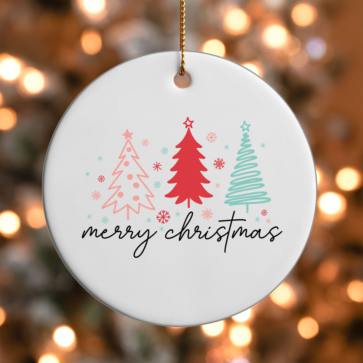 Merry Christmas Sketch Trees ornament UV DTF transfer on a round white ornament with a bokeh light background
