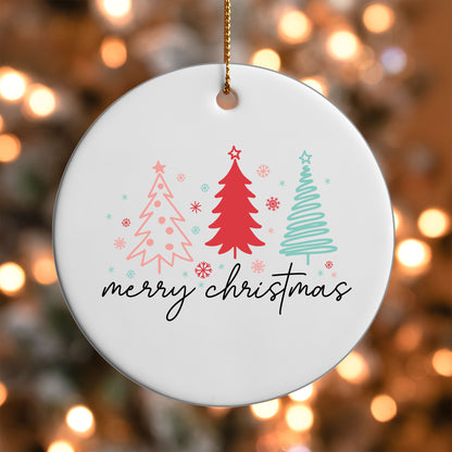 Merry Christmas Sketch Trees ornament UV DTF transfer on a round white ornament with a bokeh light background