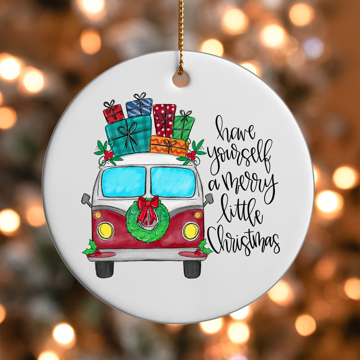 Merry Little Christmas Vintage Van ornament UV DTF transfer on a round white ornament with a bokeh light background