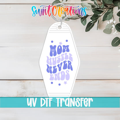 Mom Hustle Never Ends motel keychain UV DTF transfer flat lay mockup by Swiit Creations