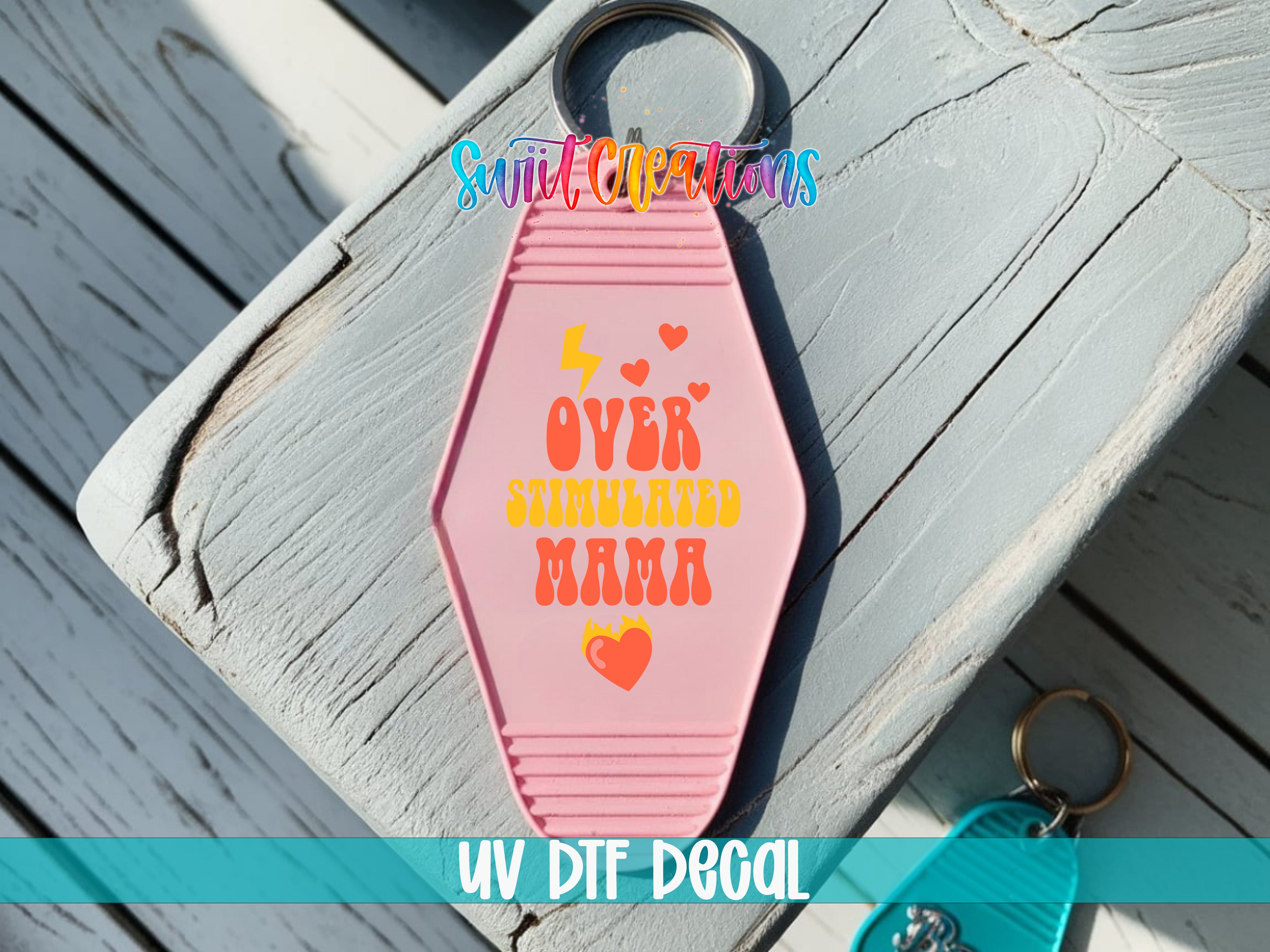 Overstimulated Mama motel keychain UV DTF transfer colored keychain mockup by Swiit Creations