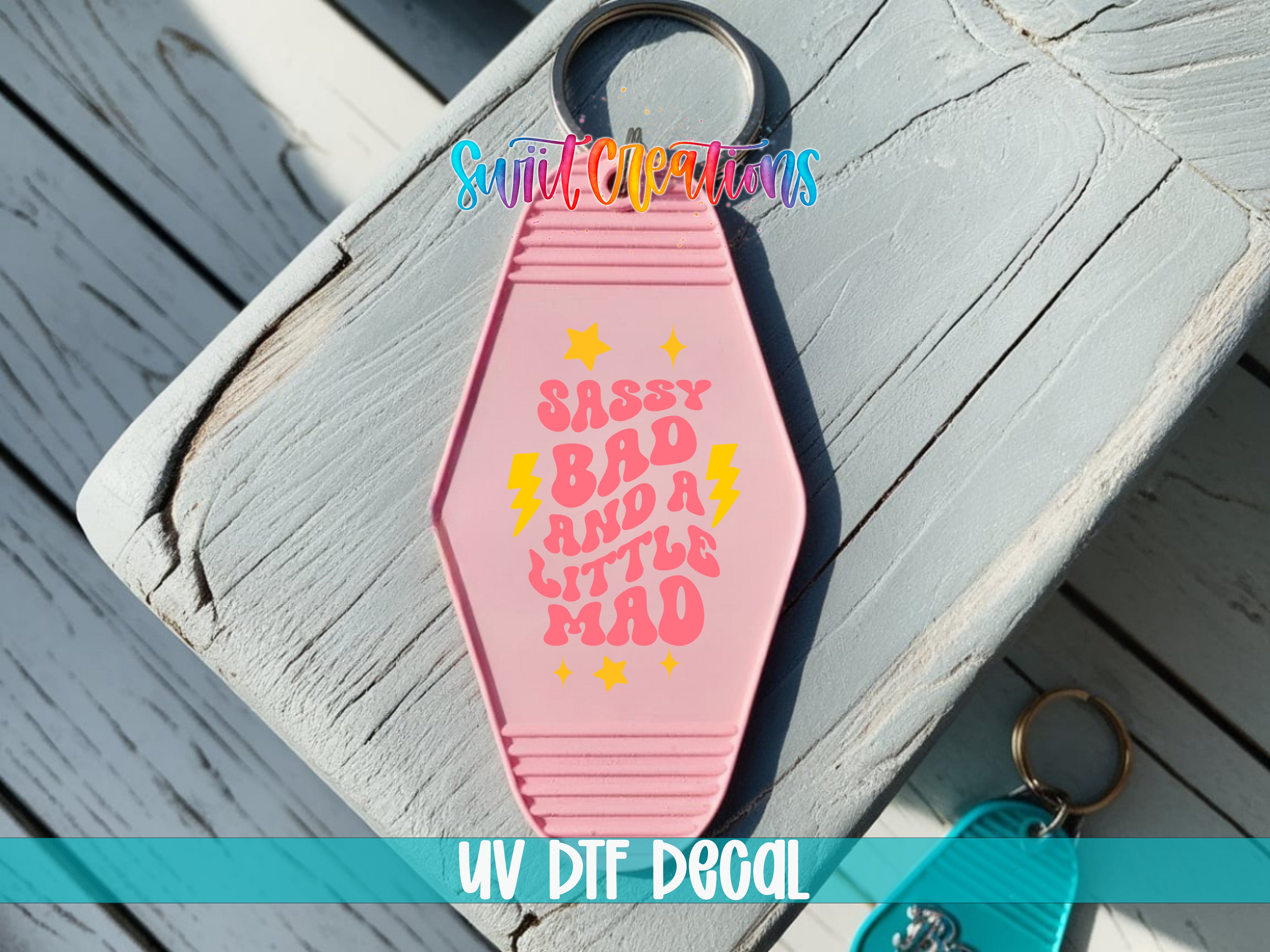 Sassy Bad and a Little Mad motel keychain UV DTF transfer colored keychain mockup by Swiit Creations