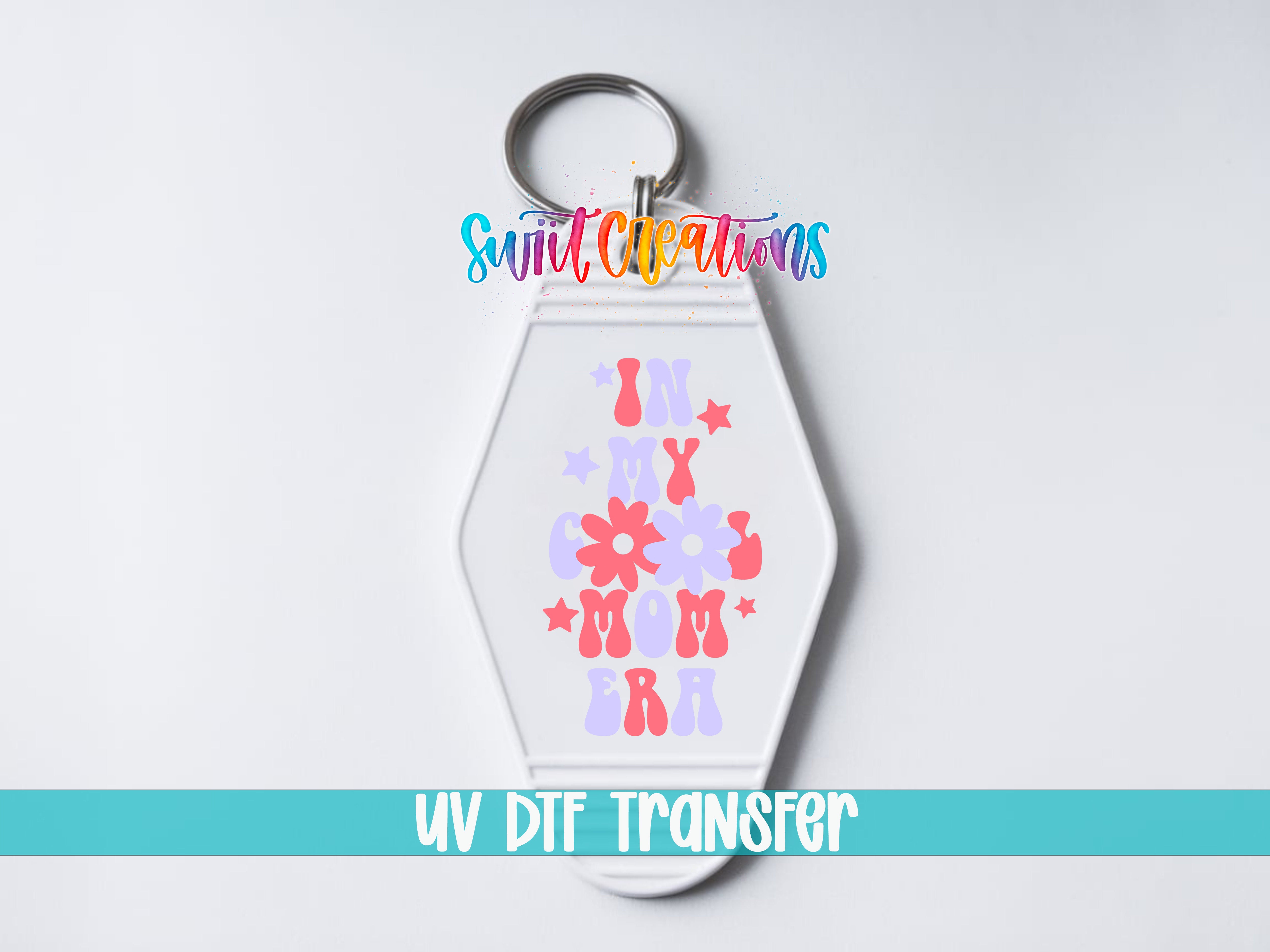 In My Cool Mom Era motel keychain UV DTF transfer close-up mockup by Swiit Creations