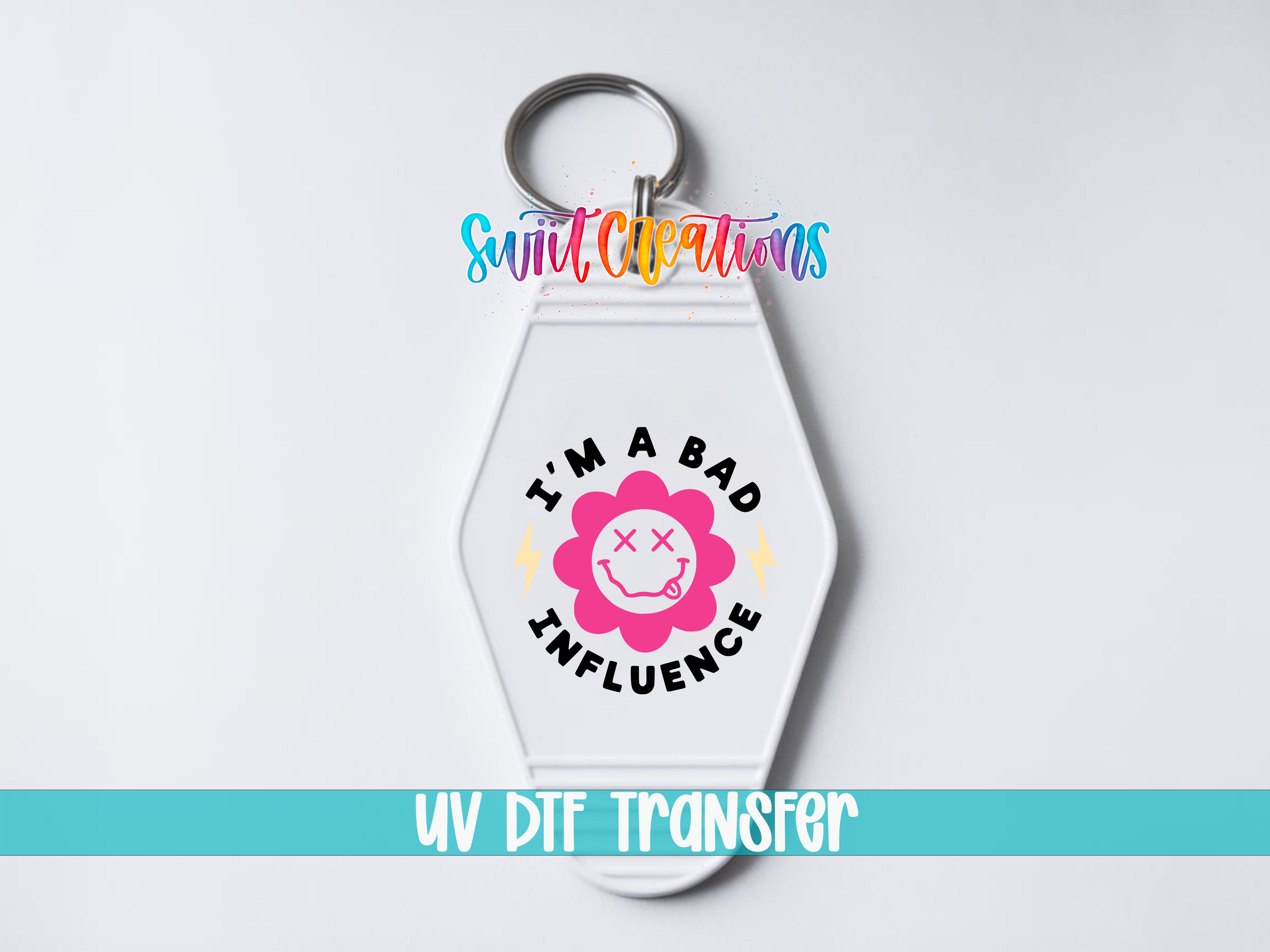 I’m a Bad Influence motel keychain UV DTF transfer close-up mockup by Swiit Creations