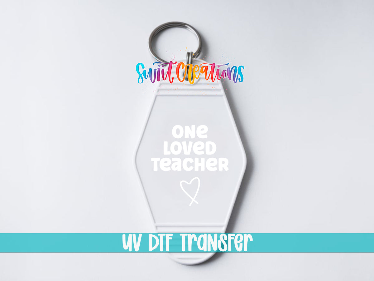 One Loved Teacher motel keychain UV DTF transfer close-up mockup by Swiit Creations