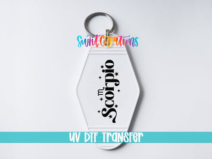 Scorpio motel keychain UV DTF transfer close-up mockup by Swiit Creations