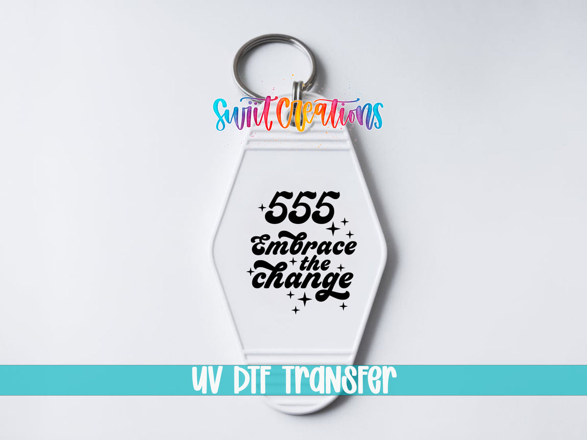 555 Embrace the Change motel keychain UV DTF transfer close-up mockup by Swiit Creations