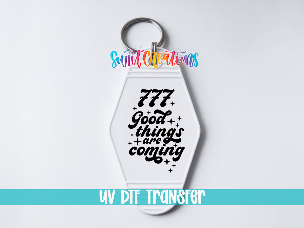 777 Good Things Are Coming motel keychain UV DTF transfer close-up mockup by Swiit Creations