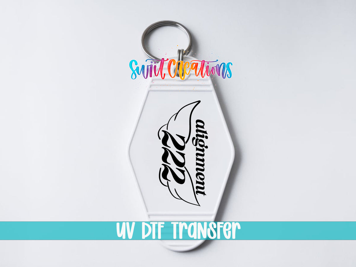 222 Alignment motel keychain UV DTF transfer close-up mockup by Swiit Creations