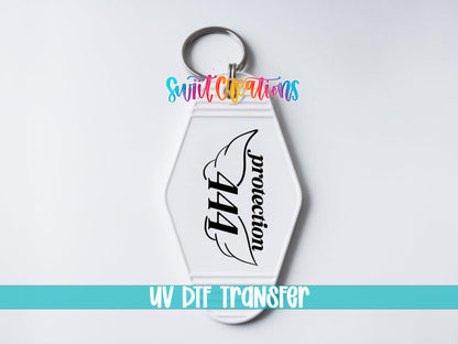 444 Protection motel keychain UV DTF transfer close-up mockup by Swiit Creations