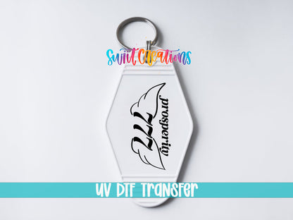 777 Prosperity motel keychain UV DTF transfer close-up mockup by Swiit Creations