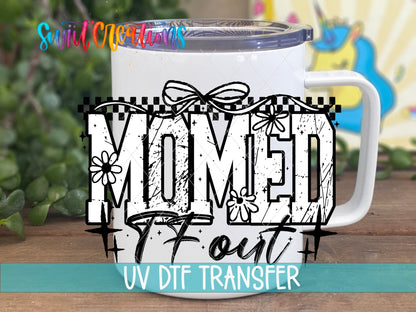 Momed TF Out UV DTF transfer on a white stainless steel mug with a lid