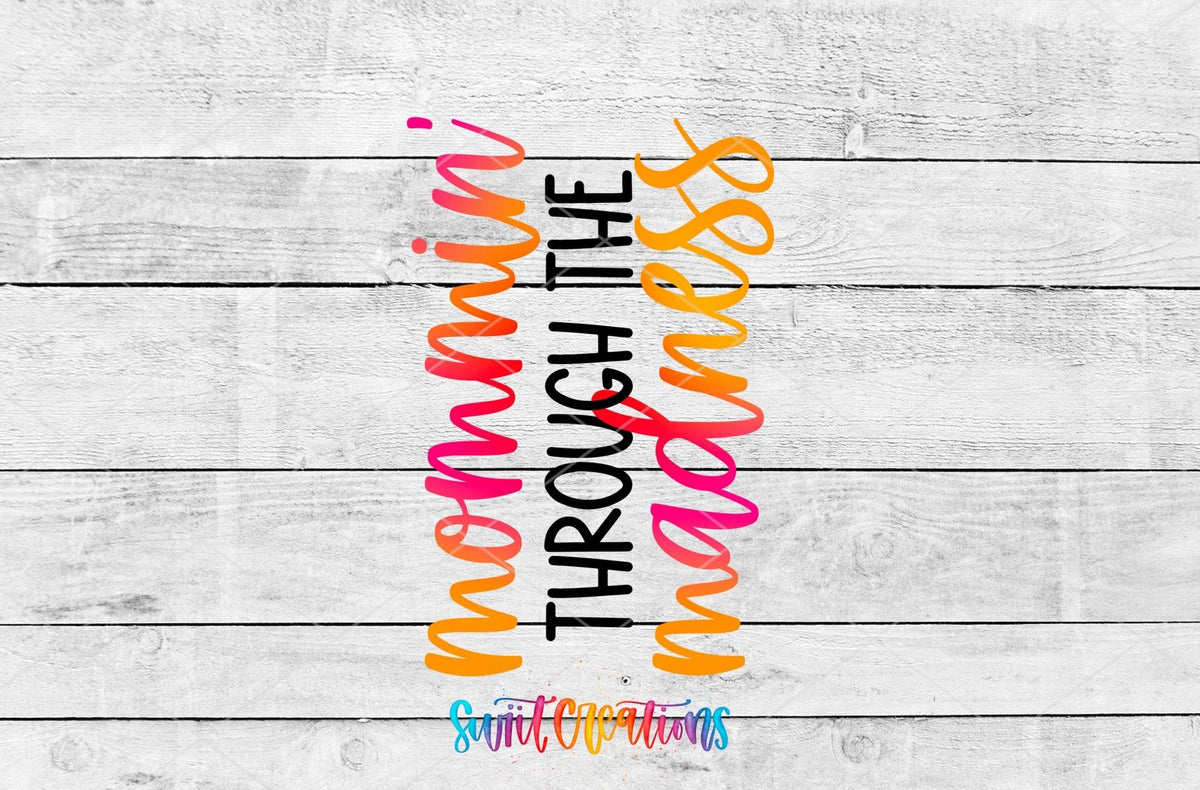 Mommin' Through the Madness UV DTF transfer artwork on a gray wood background