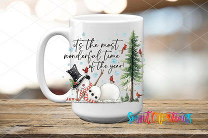 It's the Most Wonderful Time of the Year snowman and cardinals UV DTF transfer on a white ceramic coffee mug