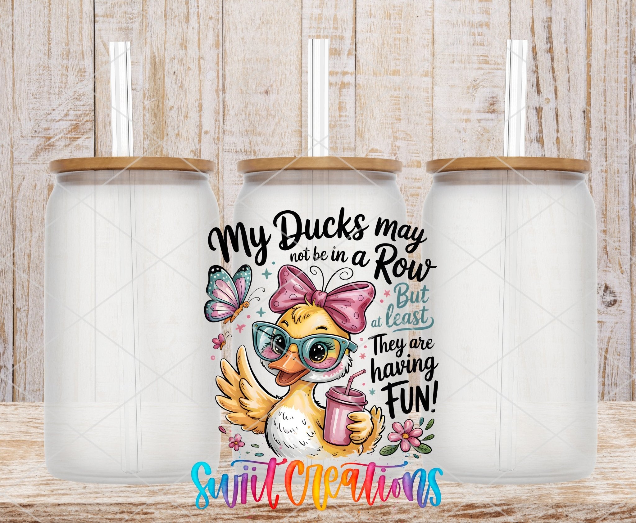 My Ducks May Not Be In A Row Funny Duck UV DTF transfer applied to a clear glass can set from Swiit Creations