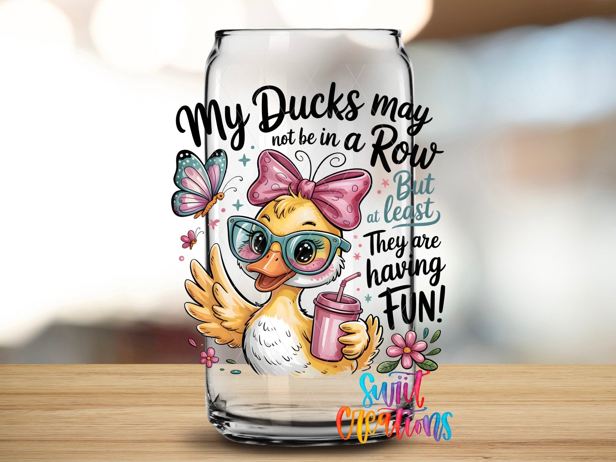 My Ducks May Not Be In A Row Funny Duck UV DTF transfer applied to a clear glass can from Swiit Creations