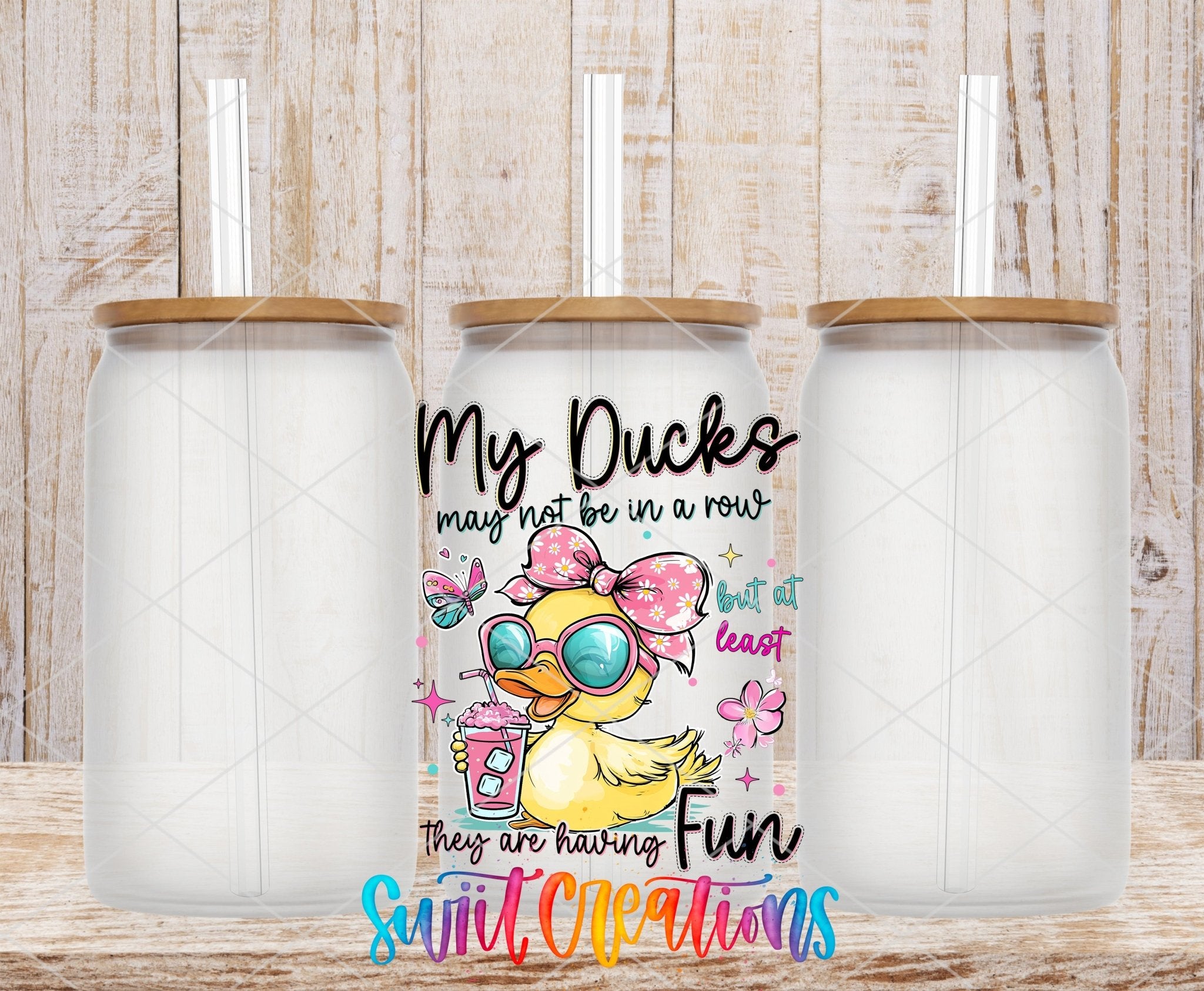 My Ducks May Not Be In A Row UV DTF transfer applied to a clear glass can set from Swiit Creations