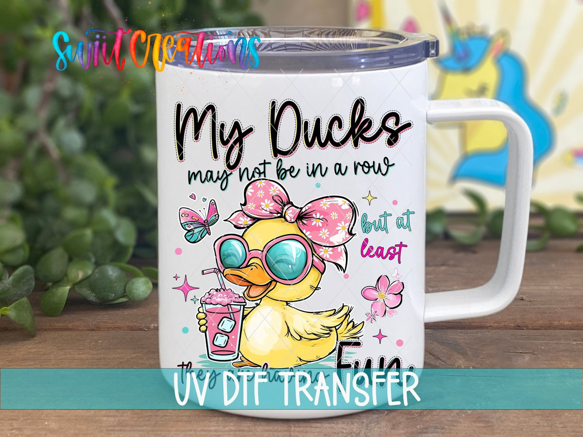 My Ducks May Not Be in a Row duck in sunglasses UV DTF transfer on a white stainless steel mug with a lid