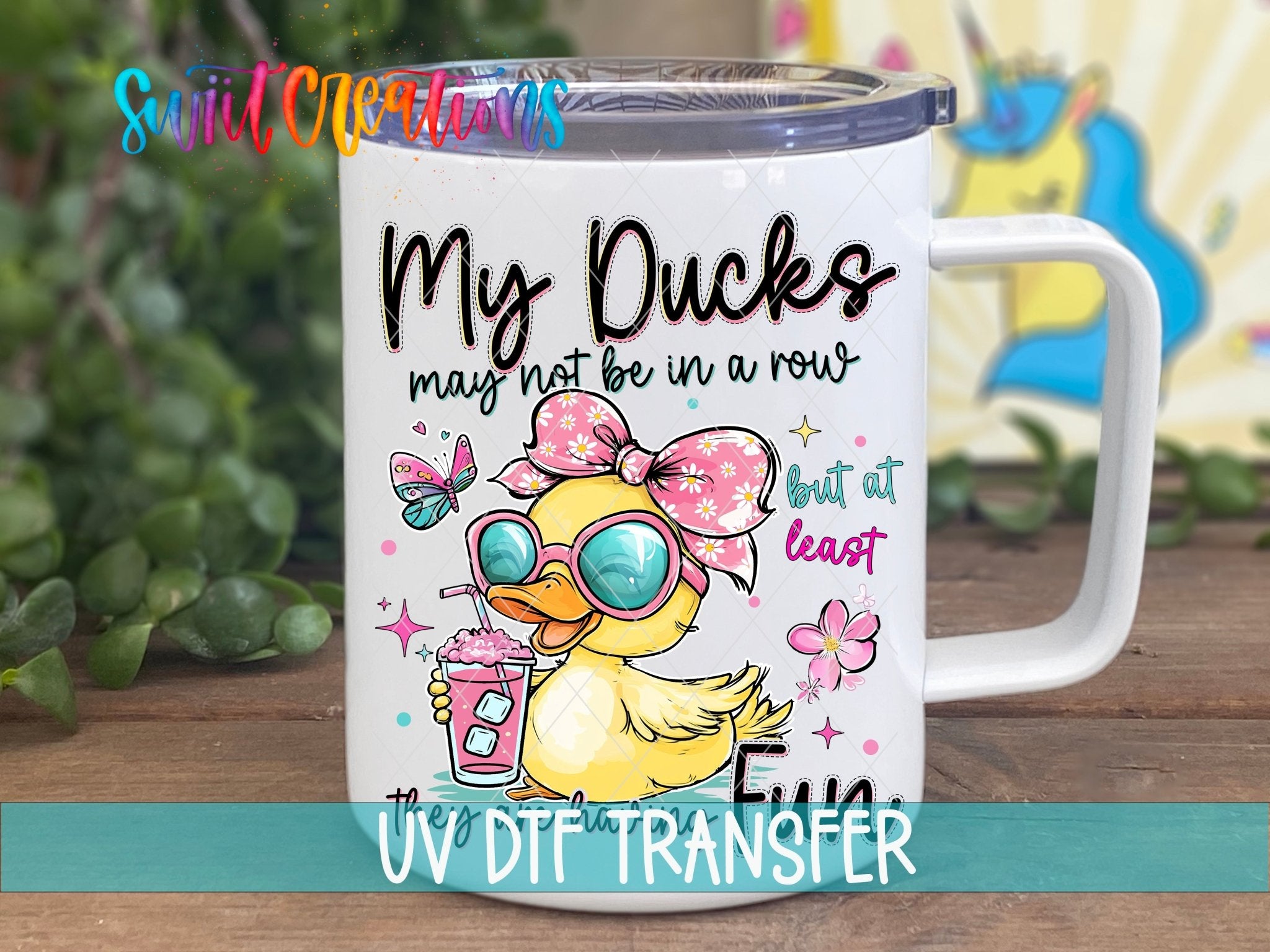 My Ducks May Not Be In A Row UV DTF transfer displayed on a white coffee mug from Swiit Creations