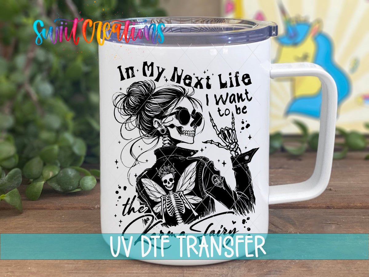 I Want to Be the Karma Fairy UV DTF transfer on a white stainless steel mug with a lid