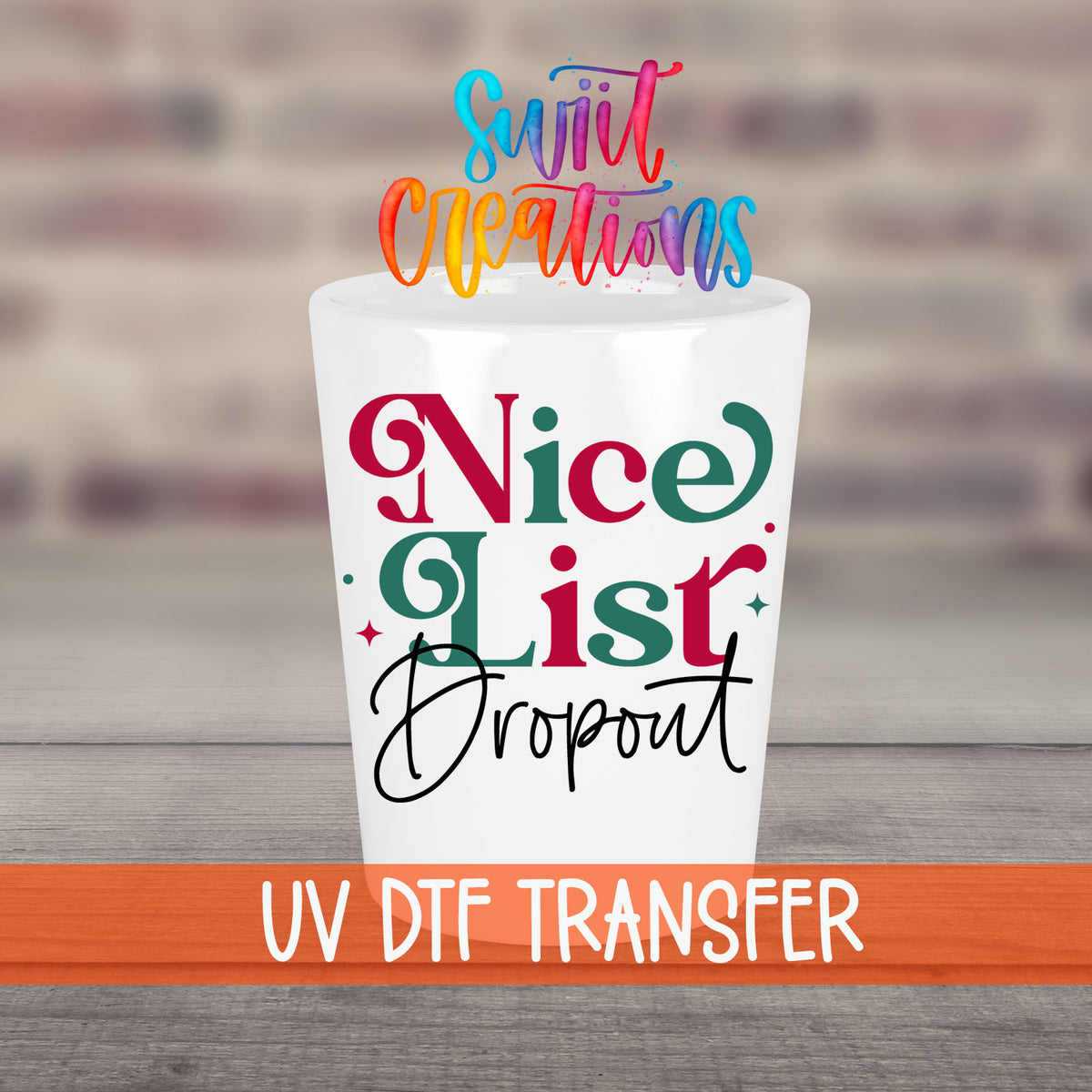 Nice List Dropout Christmas UV DTF transfer on a white shot glass in front of a brick wall