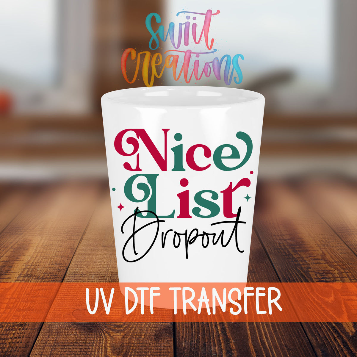Nice List Dropout Christmas shot glass transfer on a white shot glass on a wooden table