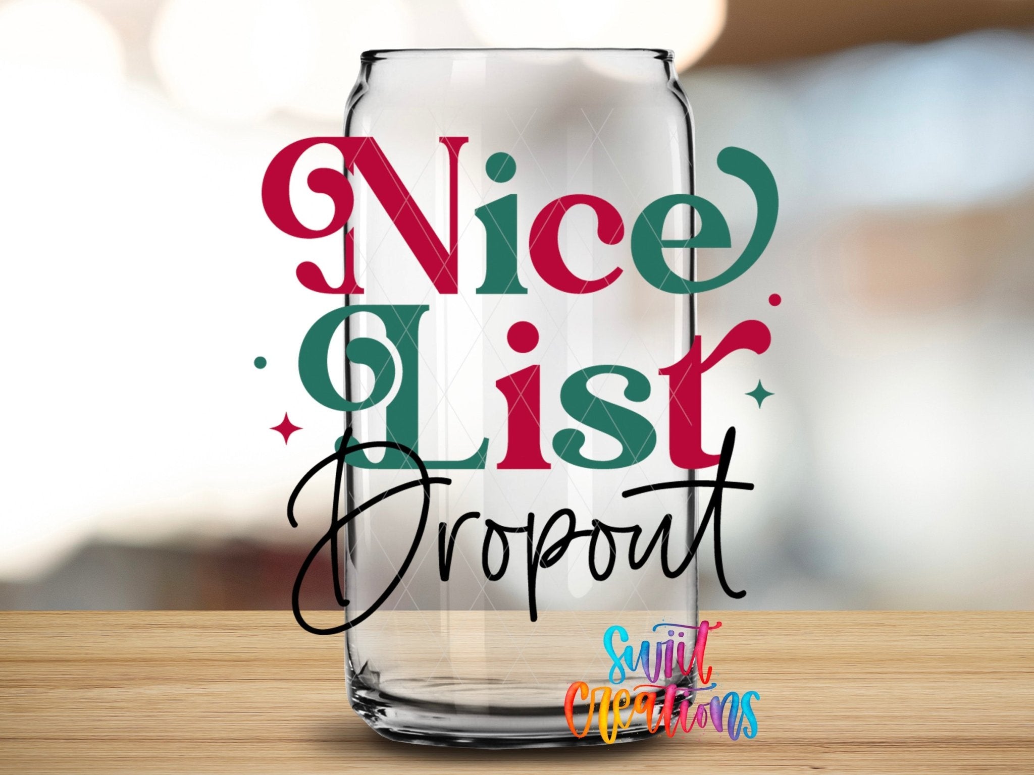 Swiit Creations UV DTF Nice List Dropout Christmas transfer applied to a clear glass can