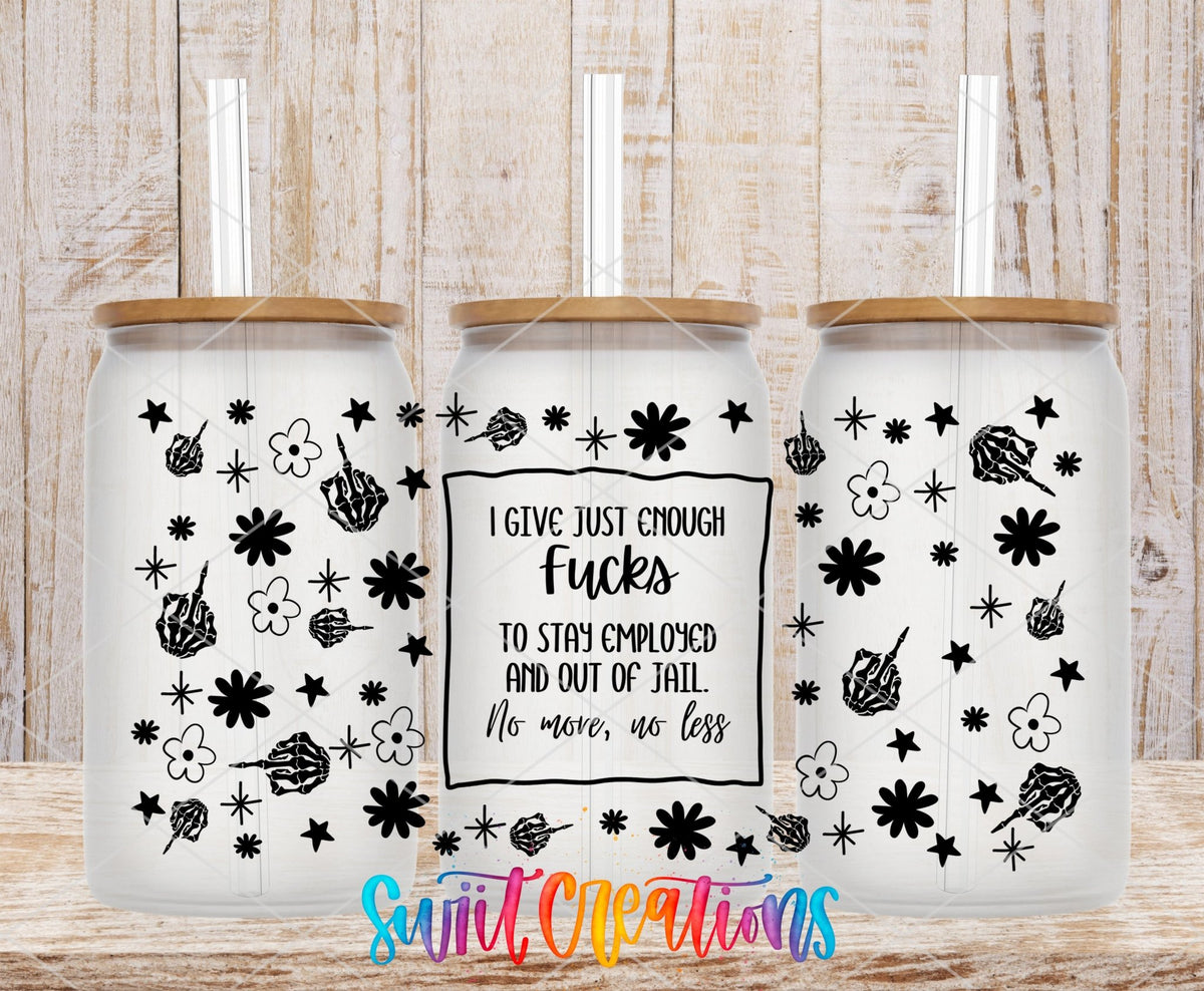I Give Just Enough F*cks black skeleton hands and flowers UV DTF full wrap on three clear glass cans with bamboo lids