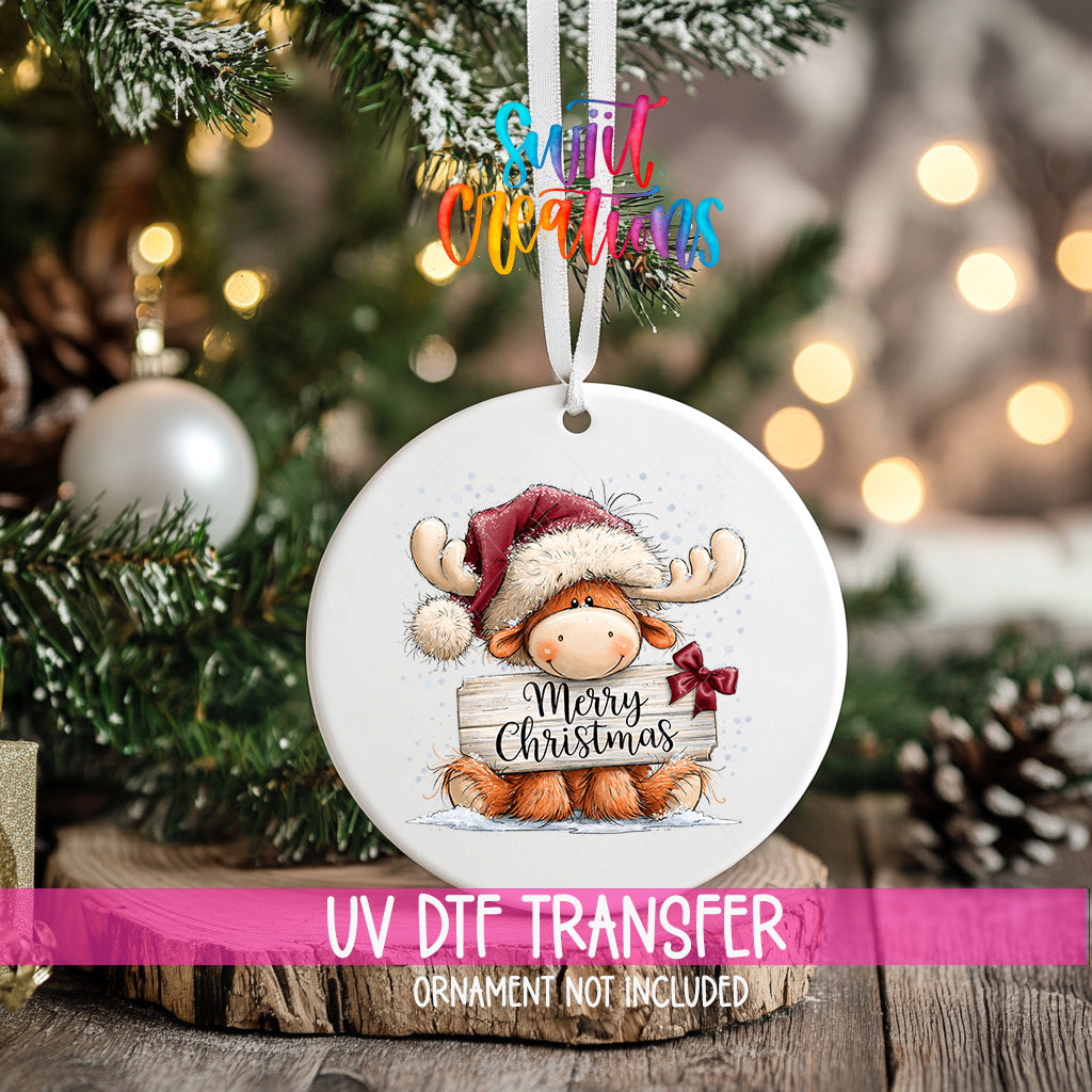 Merry Christmas moose ornament UV DTF transfer with Santa hat and burgundy bow, mockup view 2