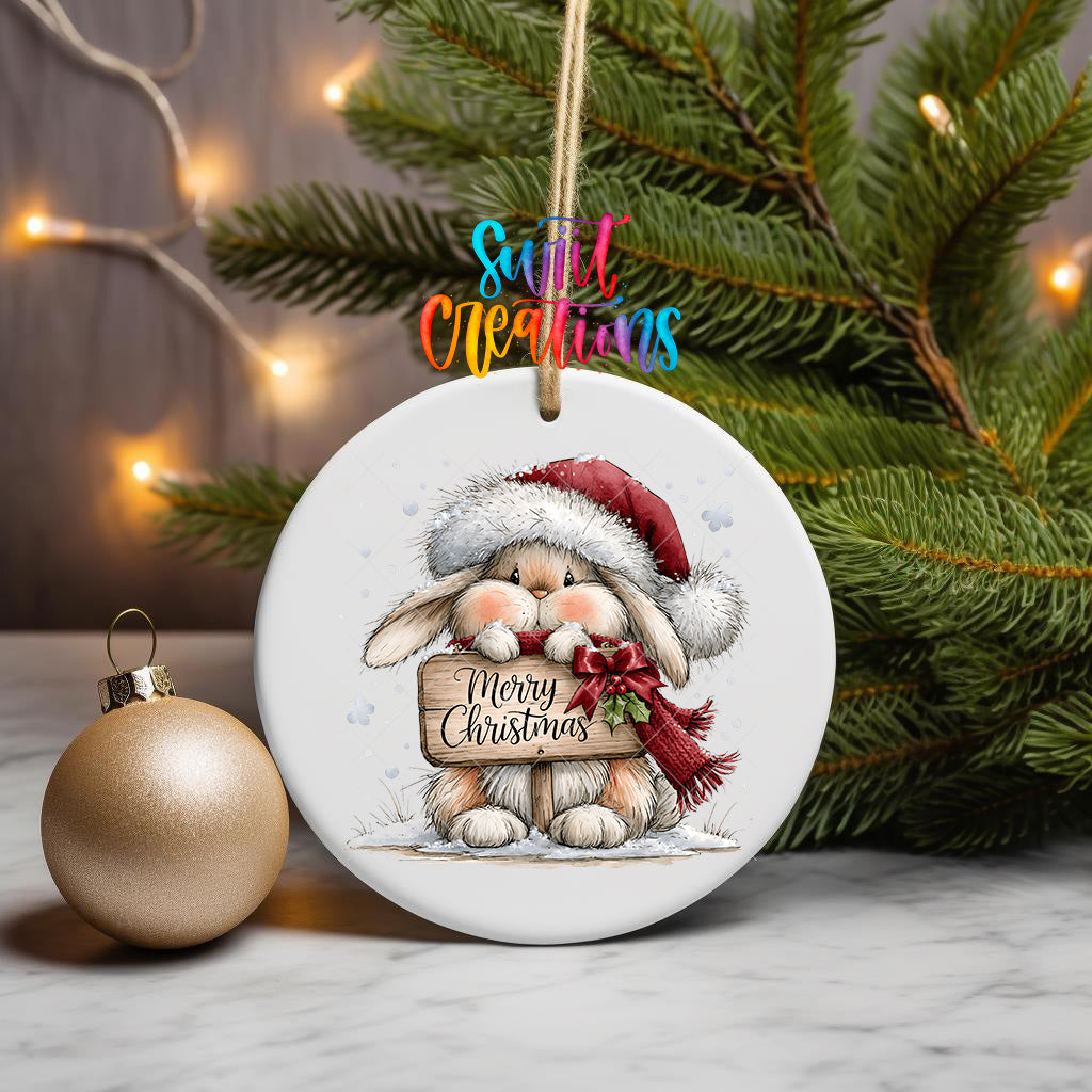 Merry Christmas bunny ornament UV DTF transfer with Santa hat, scarf, holly, and rustic sign, mockup view 3