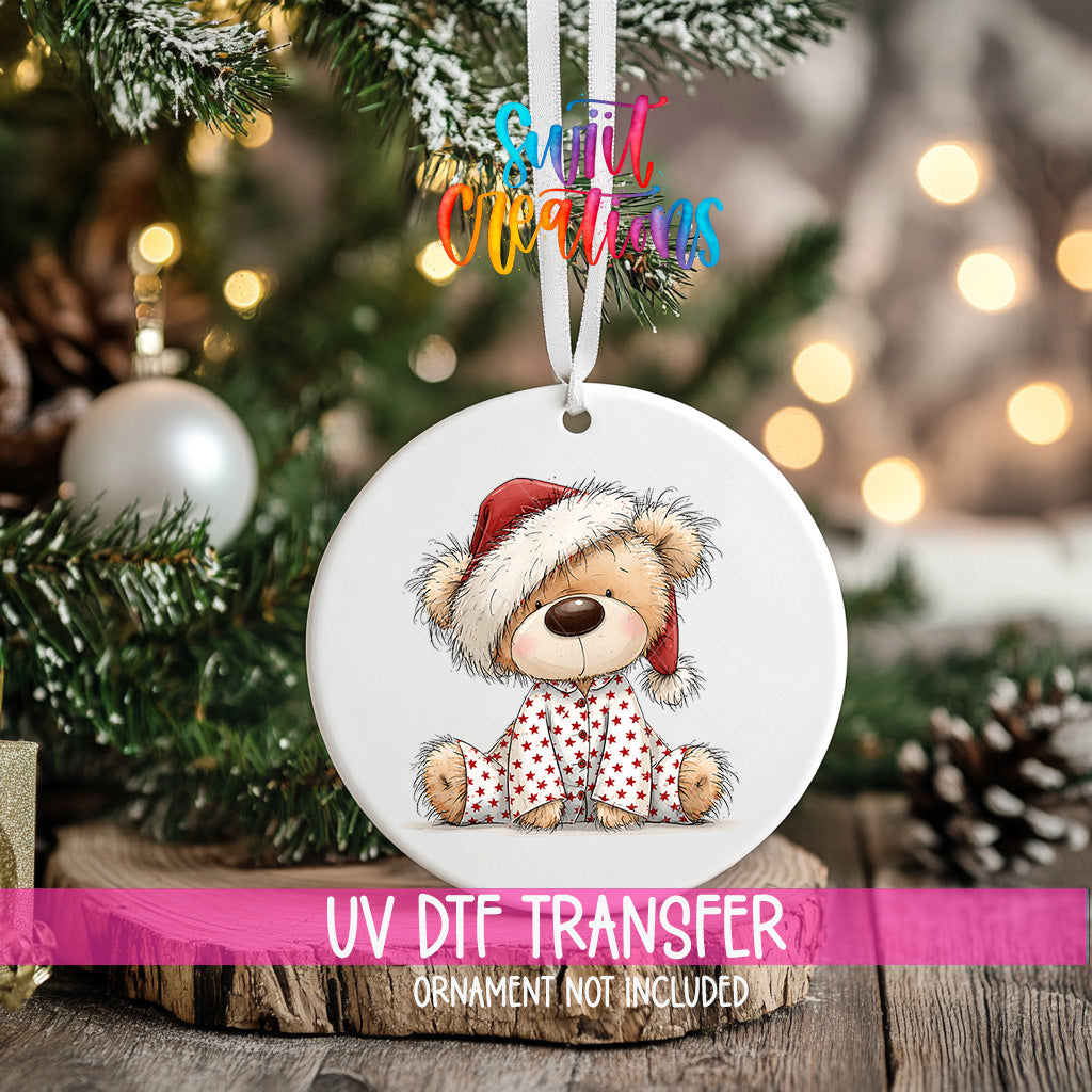 Christmas teddy bear ornament UV DTF transfer in red star pajamas and Santa hat, mockup view 2