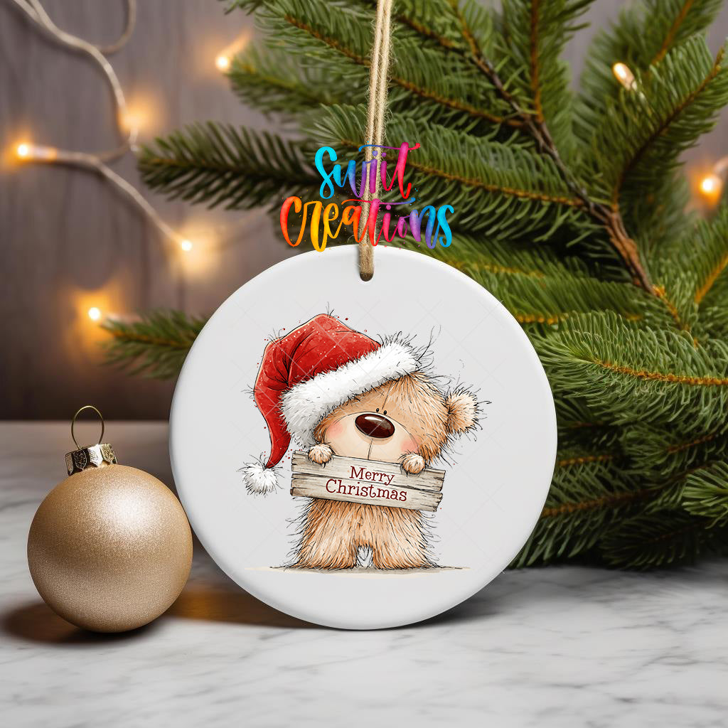 Christmas teddy bear ornament UV DTF transfer in Santa hat holding Merry Christmas sign, mockup view 3