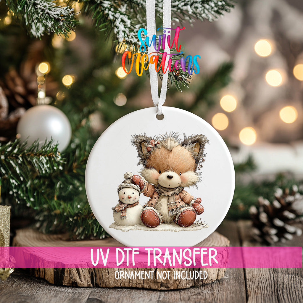 Winter fox and snowman ornament UV DTF transfer in blush pink snowy clothing, mockup view 2